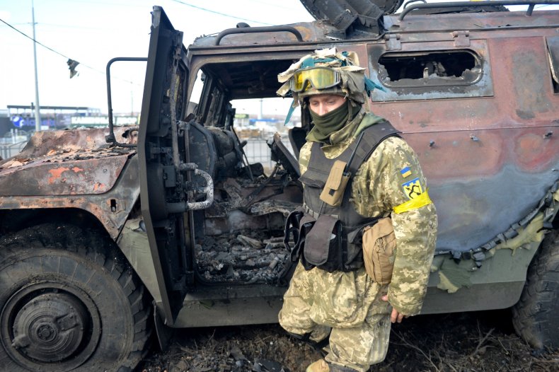 Ukraine soldiers with Russian vehicle in Kharkiv