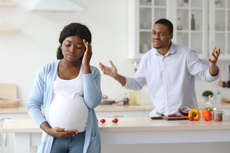 Man and pregnant woman arguing