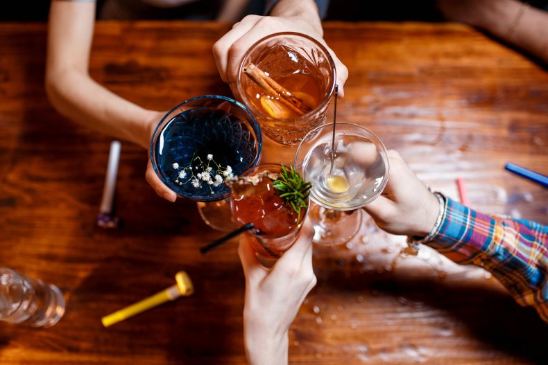 friends clinking by glasses with various alcoholic