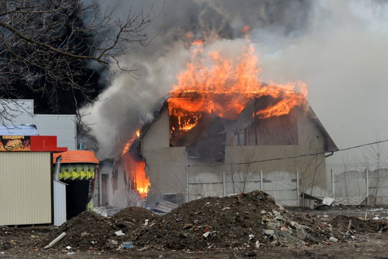 Bombed building burns in Kharkiv Ukraine
