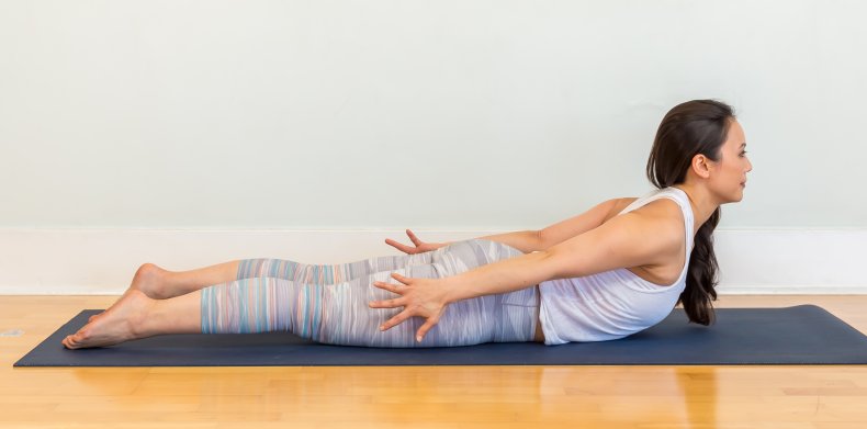 Dr. Ingrid Yang in a locust pose.
