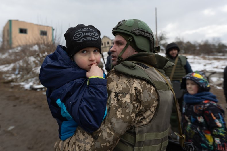 Ukrainian troop with child