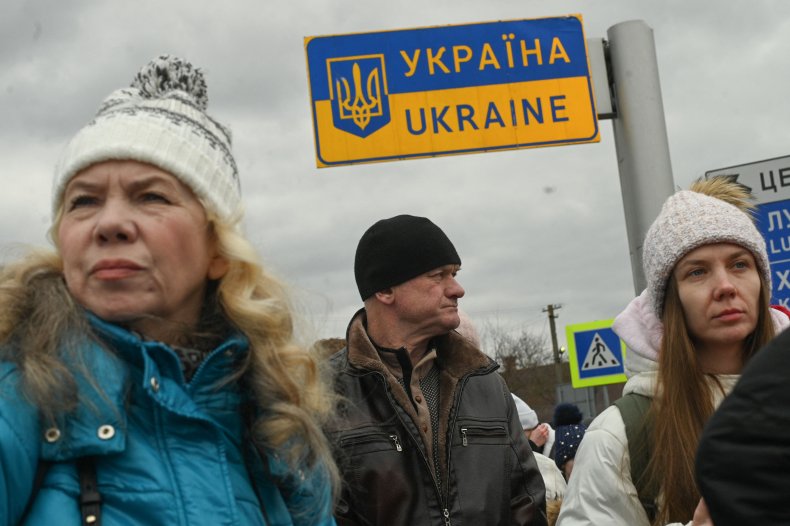 Ukrainian refugees wait in the line 