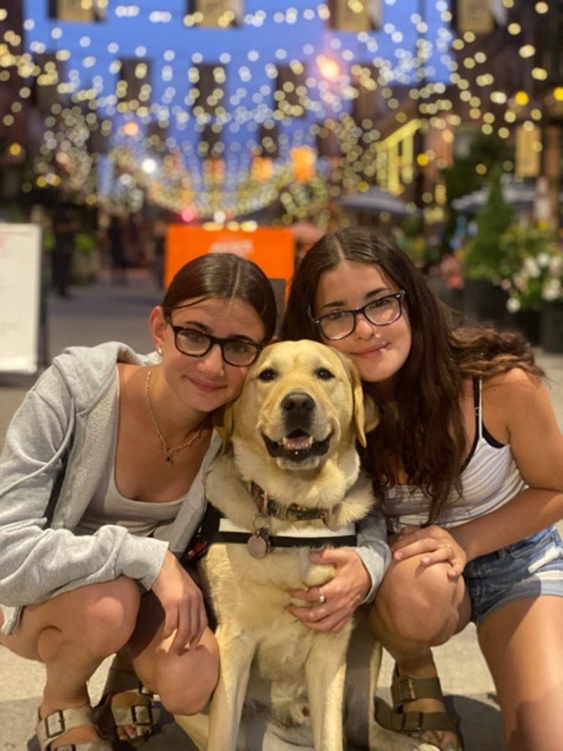 Magnus the therapy dog and his family.