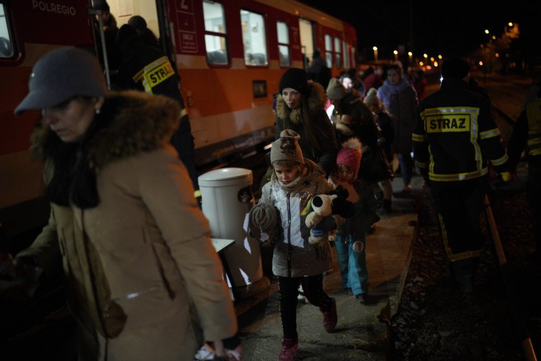 Refugees board train