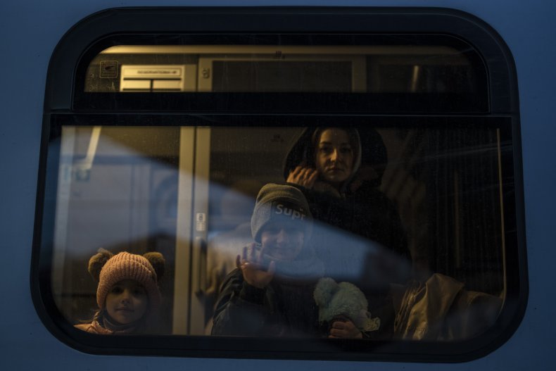 Ukrainian refugees board train