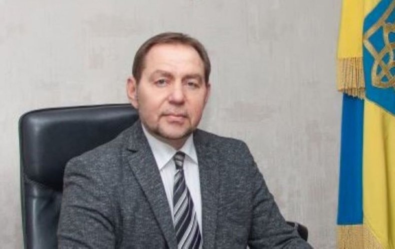 Yevhen Matveyev sits at a desk