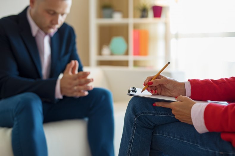 A person sitting at therapy session. 