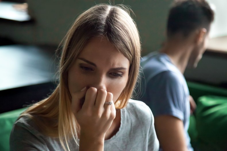 Upset woman beside a man