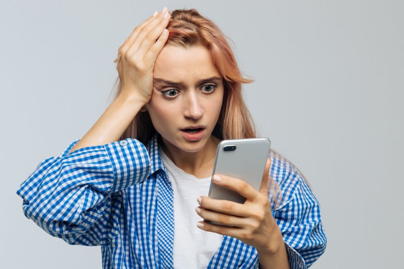 Shocked woman texting