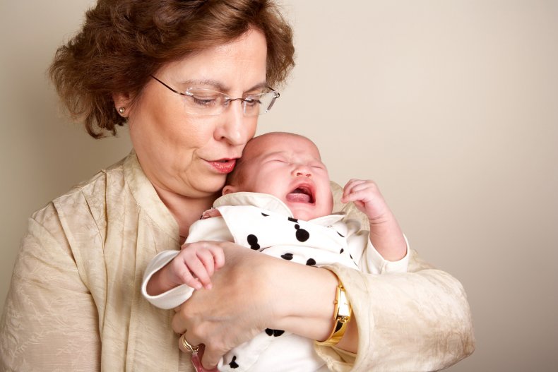 An elderly woman and a screaming baby.