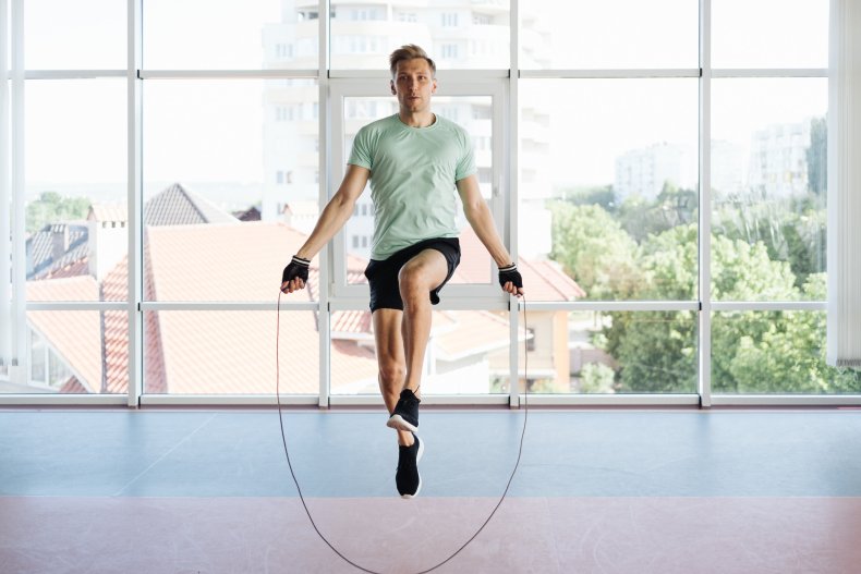 A man doing jump rope exercises.