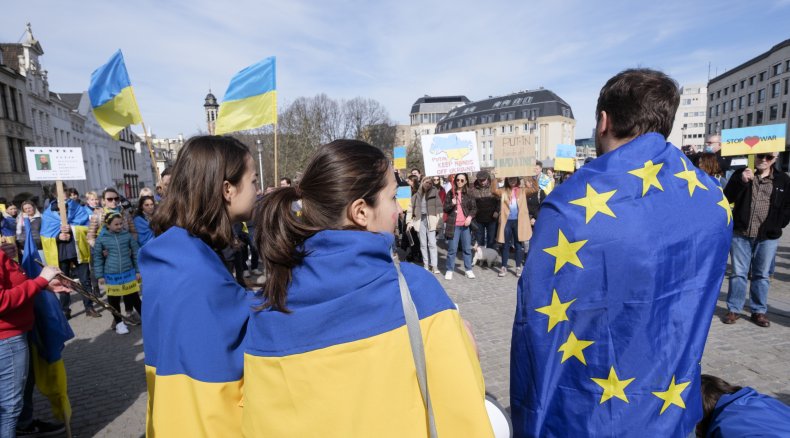 Protesters with Ukraine and EU flags Brussels