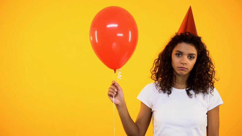 woman holding balloon