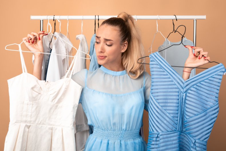 Woman struggles to choose outfit