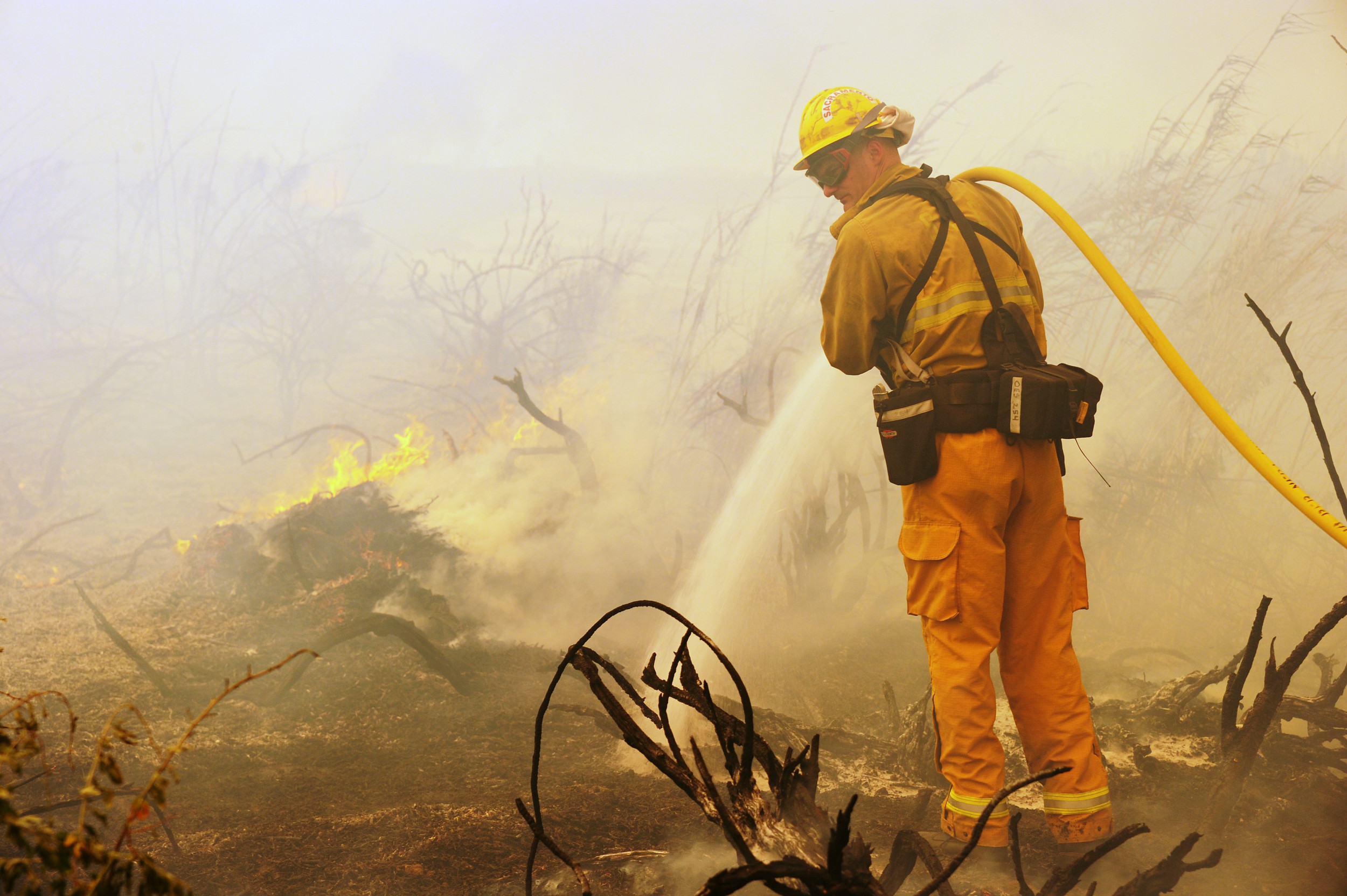 Firefighters battle wildfire flare ups on a greek island more evacuations have been ordered