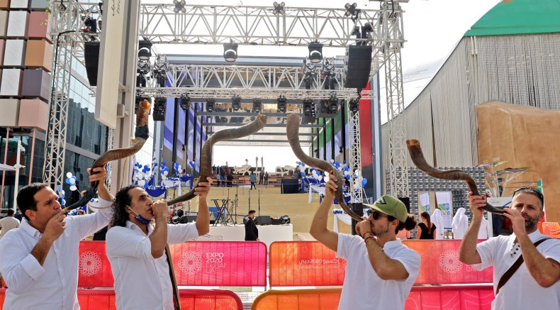 Men blow shofars (traditional Jewish religious instrument