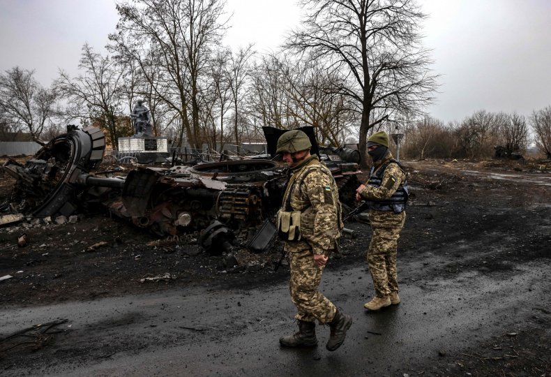 Ukraine soldiers with destroyed Russian tank Kyiv