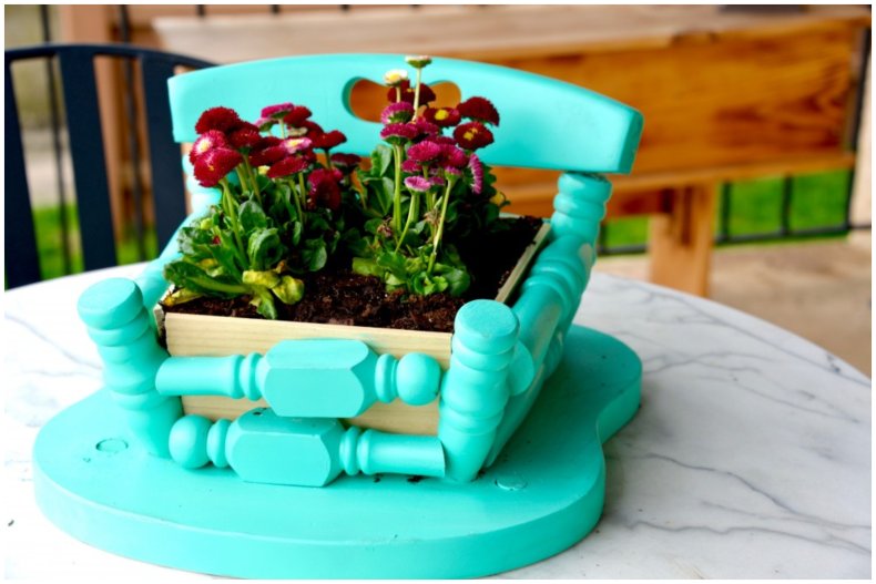 A DIY chair plant stand.