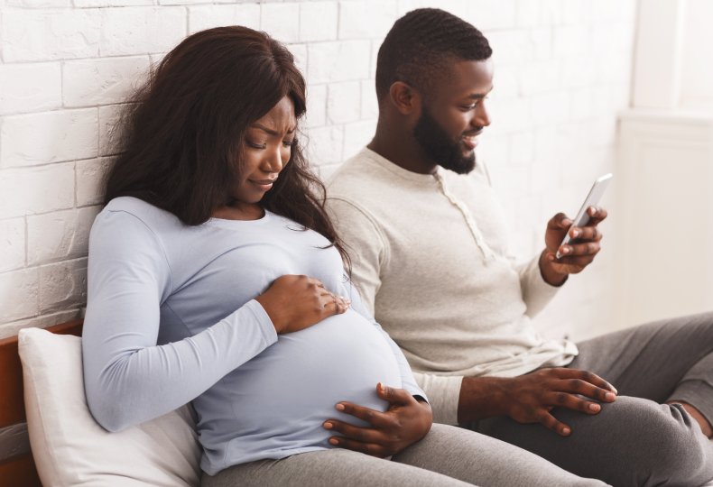 Man Ignoring Pregnant Partner for Phone