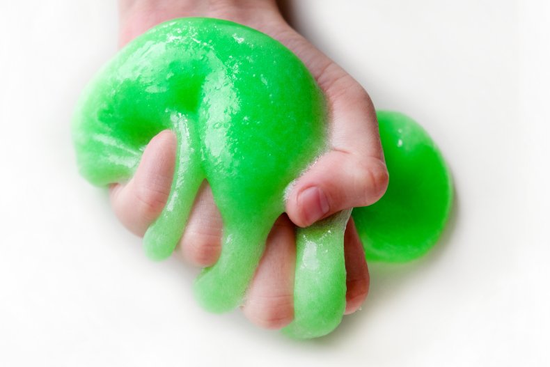 A man holding slime.