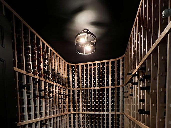 Finished wine cellar with wooden racks Finished wine cellar with wooden racks