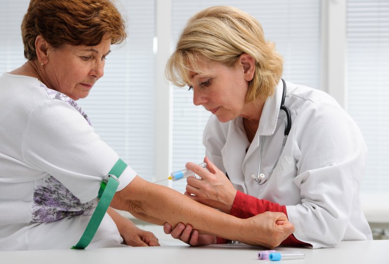 A person getting blood drawn for testing.