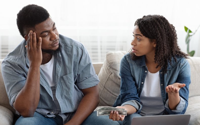 A man and woman arguing over money.