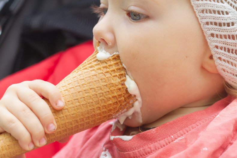 Baby eating ice cream close up