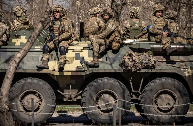 Ukraine soldiers sit on a tank