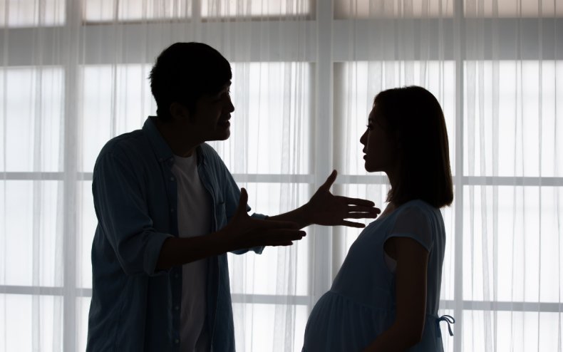 A man arguing with a pregnant woman.
