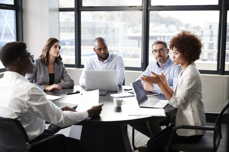 A group of people in a meeting.
