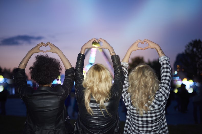 Heart shape made of human hands at