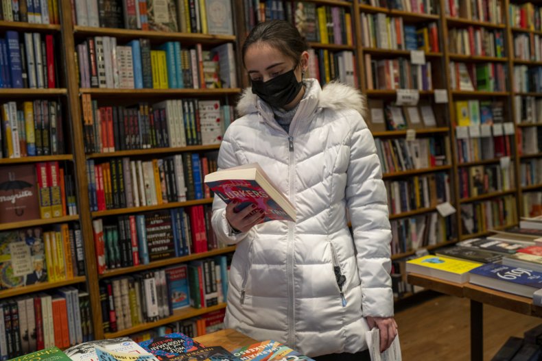 A woman searches in a book store