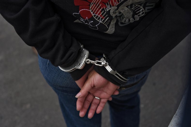 arrest woman handcuff gang 