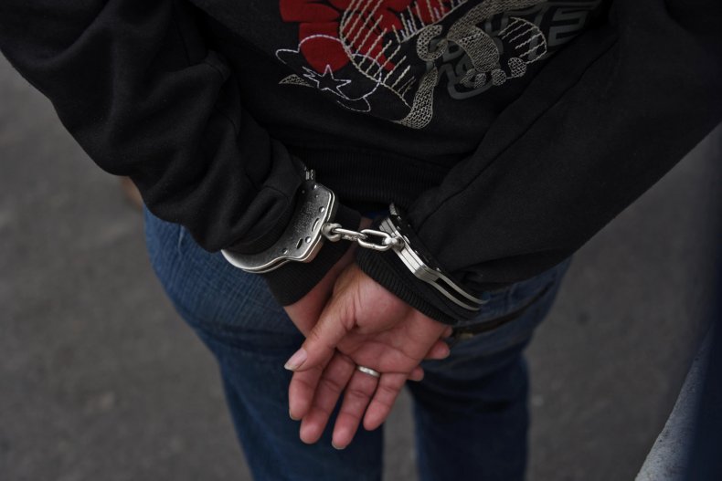 arrest woman handcuff gang