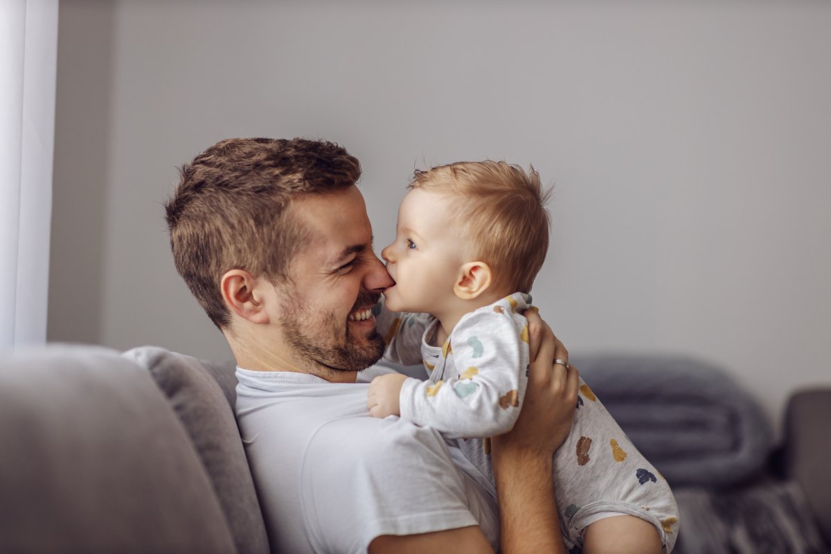 Toddler biting father's nose