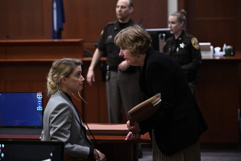 Amber Heard speaks with lawyer