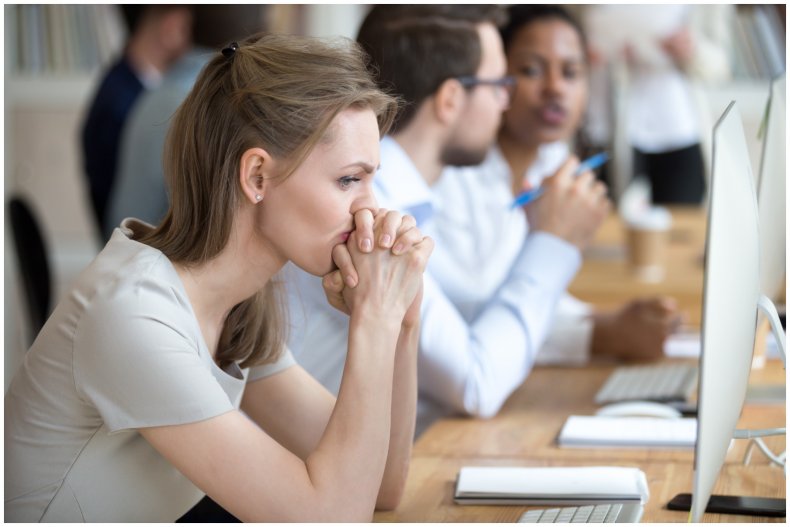 Stock image of concerned woman at work
