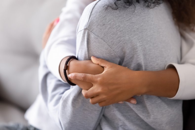 parent hugging teen