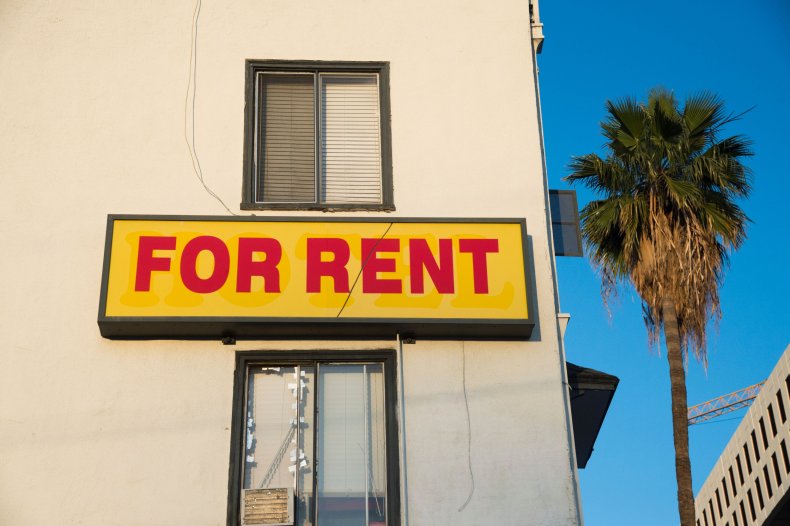 A "For Rent" sign is seen 