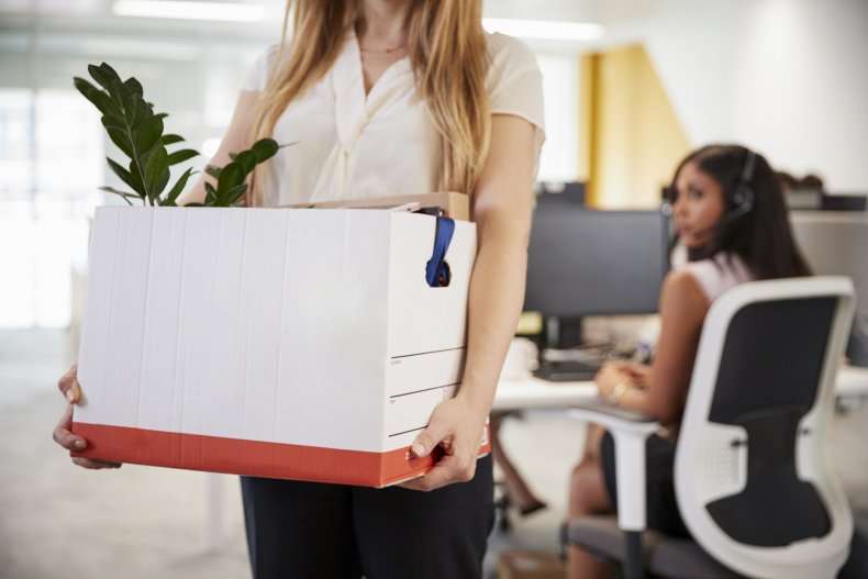 Female employee packing her belongings to leave