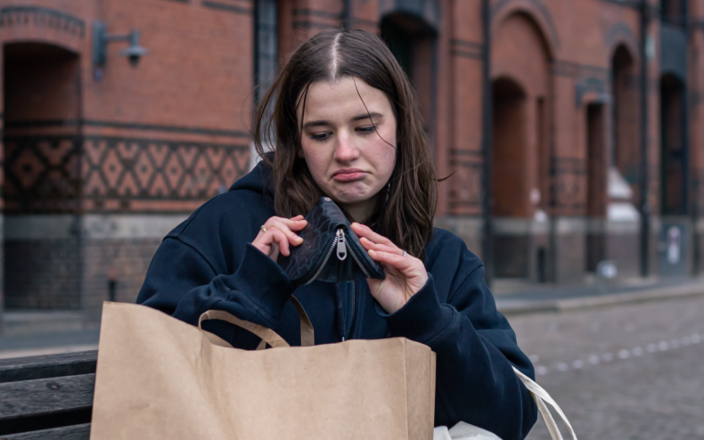 A woman with an empty wallet.