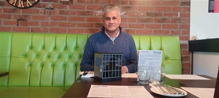 Patrons Willing to Put Their Phones in Cage Get Discount at This Restaurant  - Newsweek