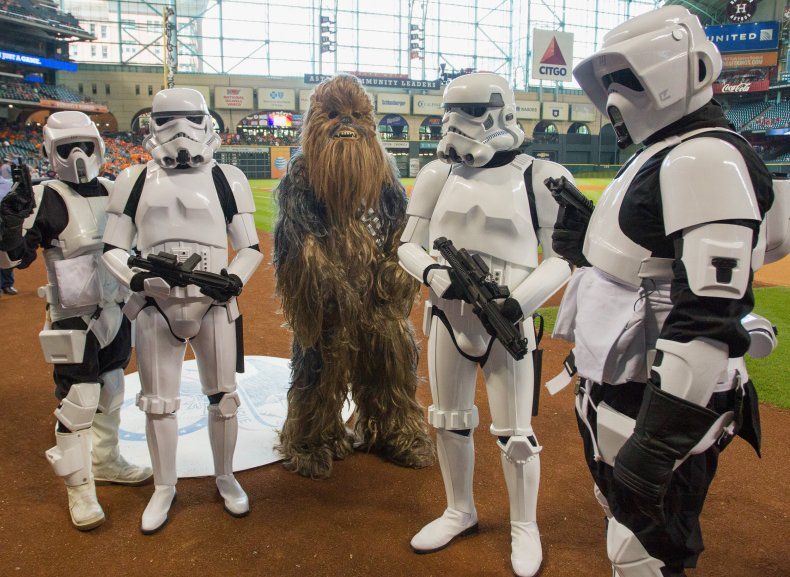 The Brilliant Ways To Celebrate Star Wars Day, Revealed By Super Fans 4 A character from Chewbacca with the Stormtroopers