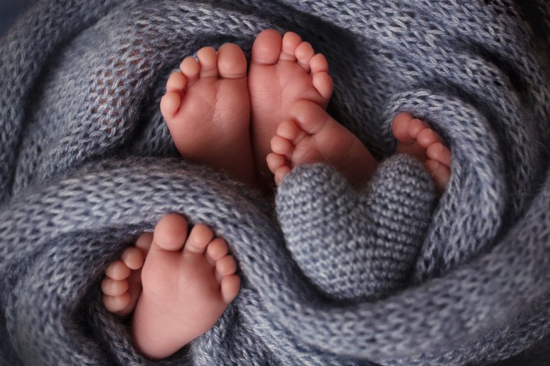 Three pairs of baby feet