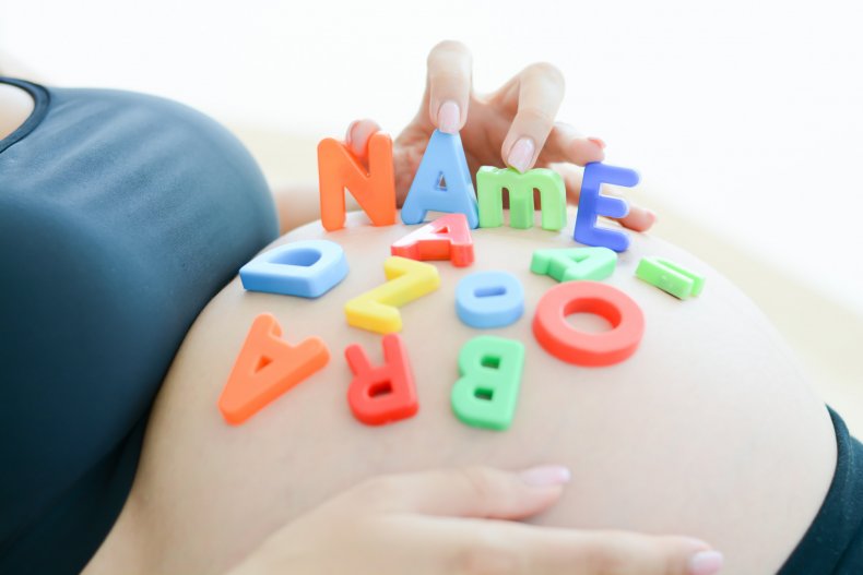 Pregnant woman, letter toys