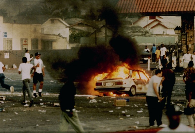 A car burns during 1992 riots 