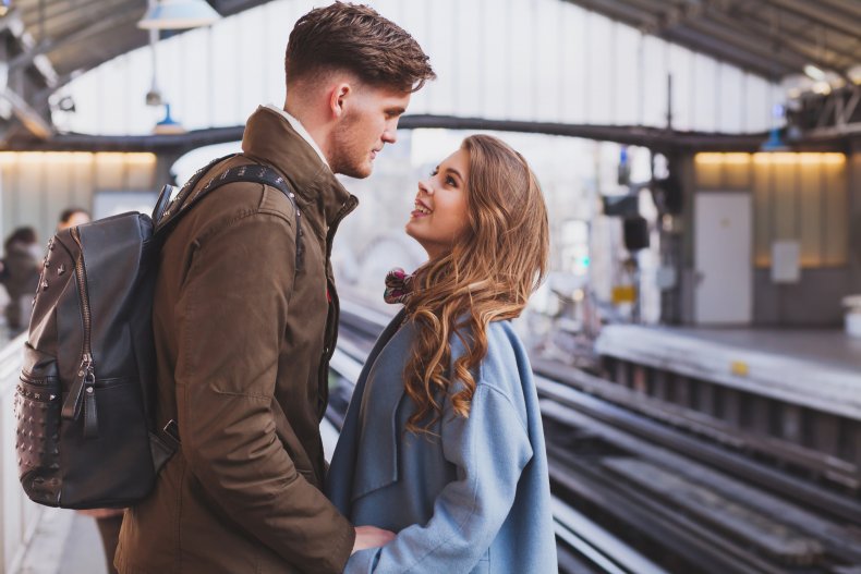 A couple looking at each other longingly.