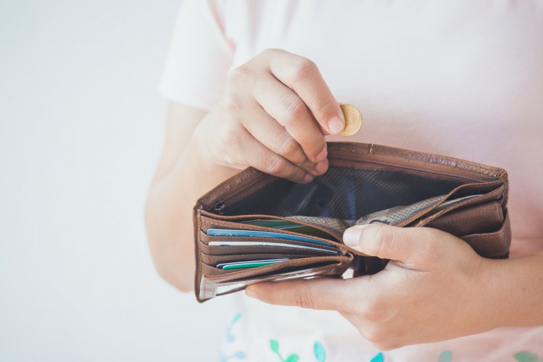Person holding an empty wallet